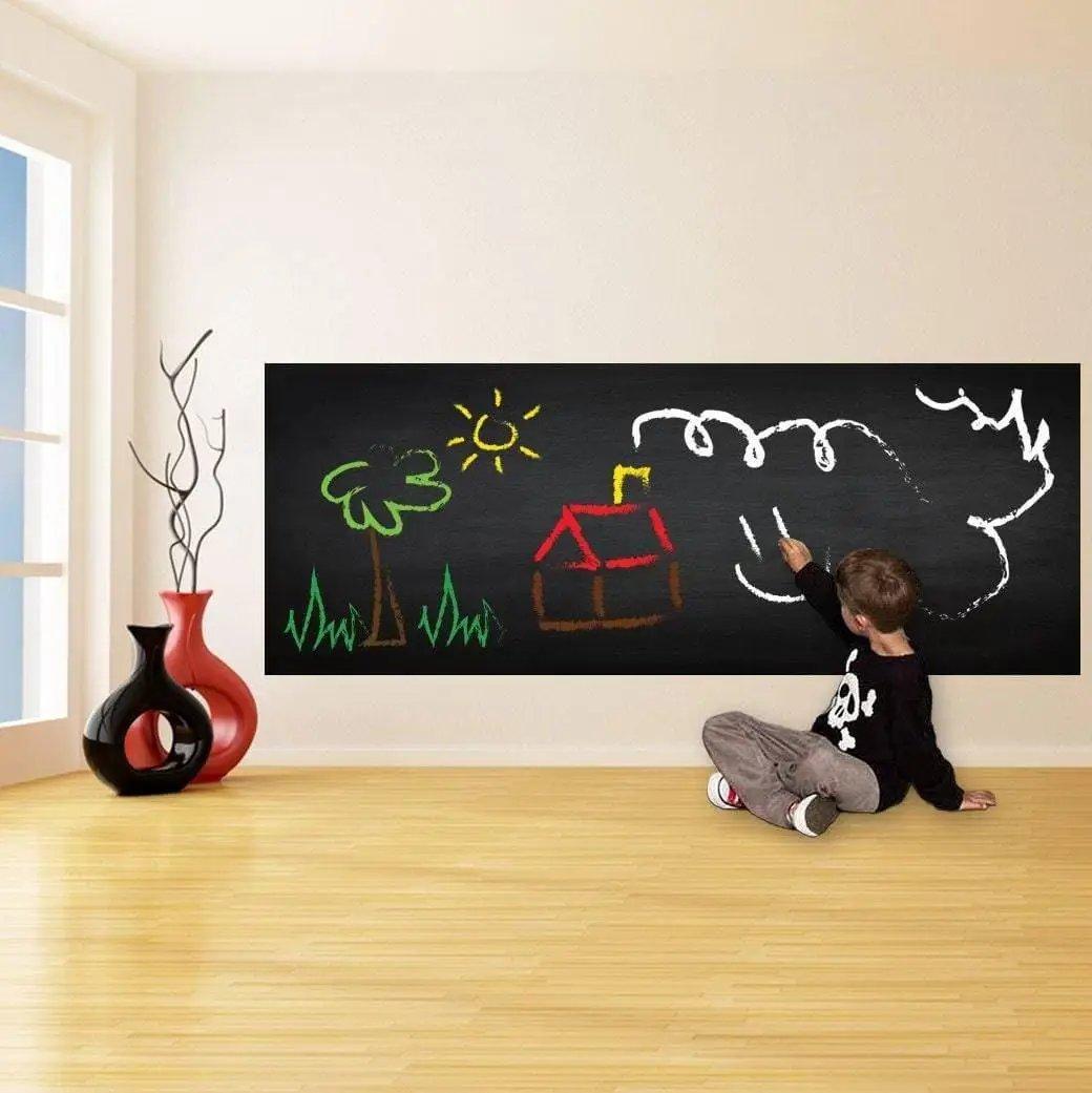 Child drawing on a reusable chalkboard wall sticker, showcasing creativity in a modern living space.