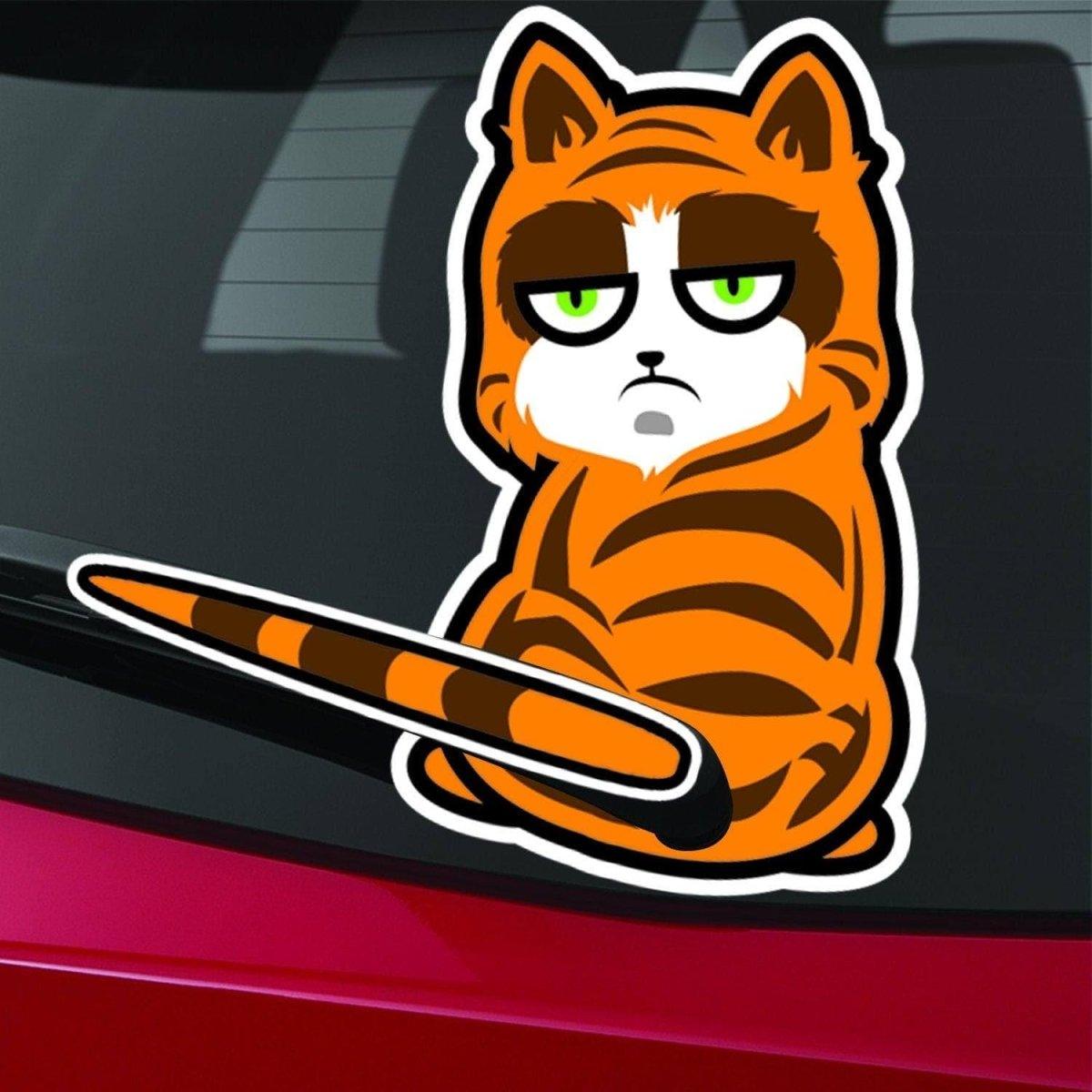 Playful perforated cat rear window decal sticker on a vehicle, featuring an orange cat design.
