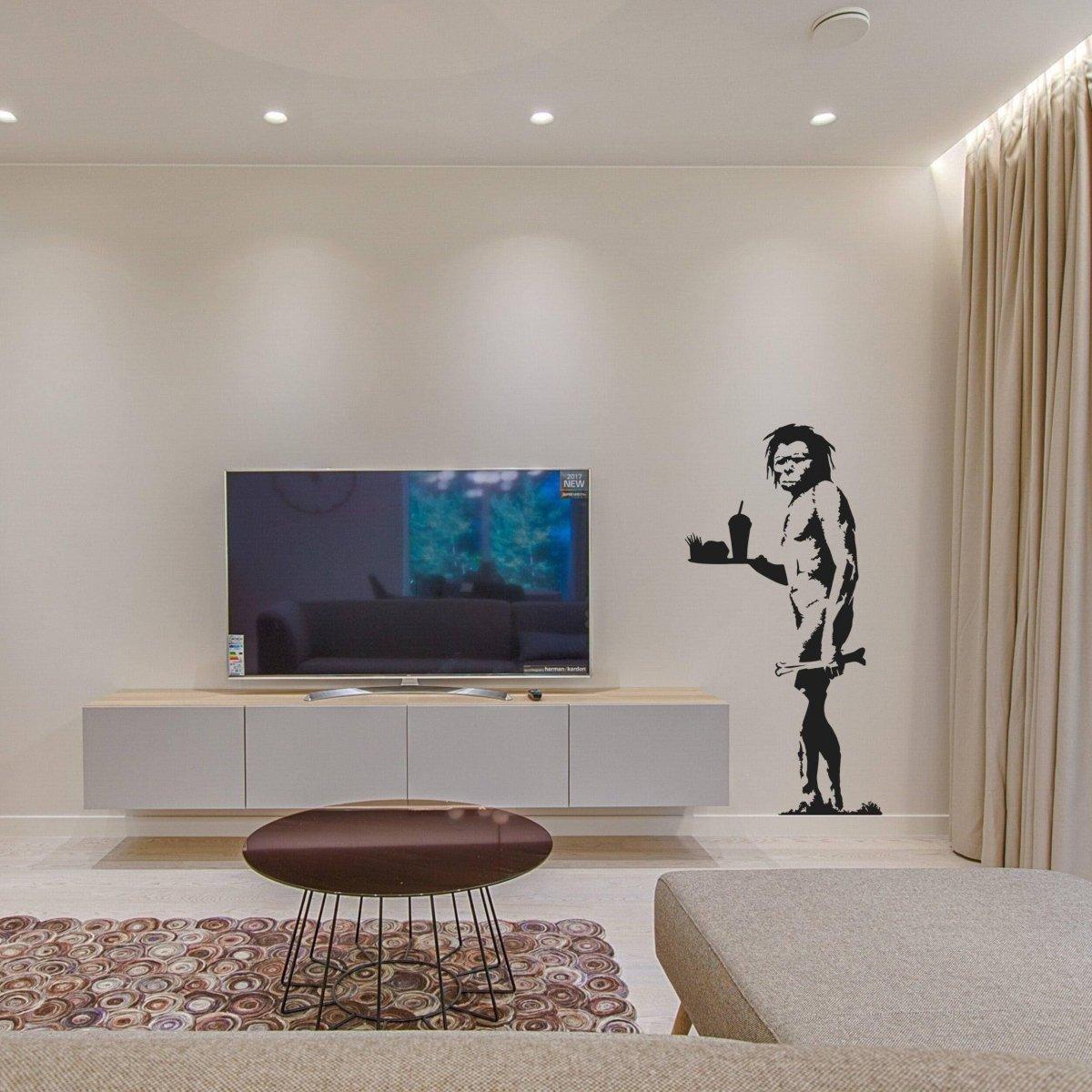 Caveman jokes vinyl wall decal on a living room wall, adding humor and style to the modern interior.