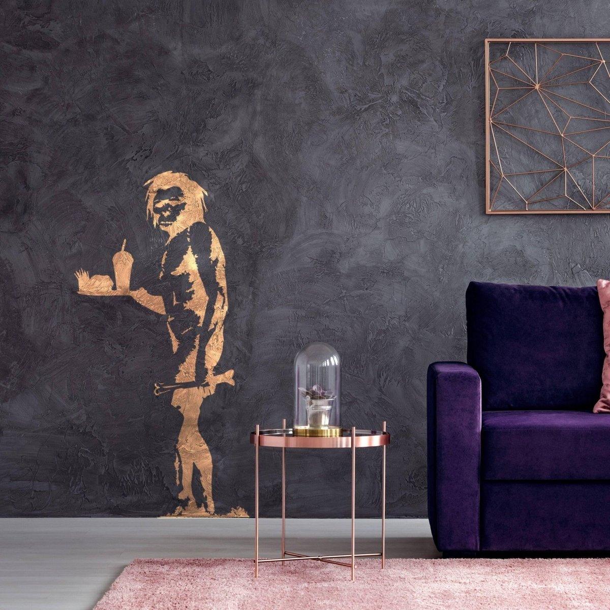 Caveman jokes vinyl wall sticker on a dark wall, adding humor to a modern living space.
