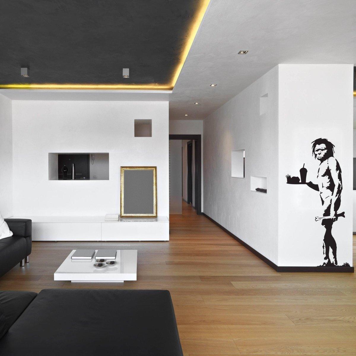 Stylish living room featuring a humorous Caveman Jokes vinyl wall sticker in comic style, enhancing the modern decor.
