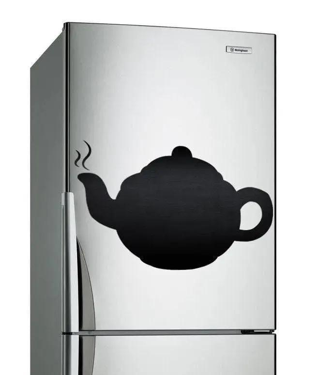 Magnetic chalkboard sticker of a teapot design on a silver refrigerator, enhancing kitchen decor.