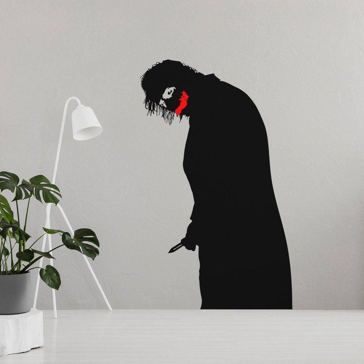 Creepy clown vinyl decal featuring a menacing smile, perfect for spooky wall decoration in any room.