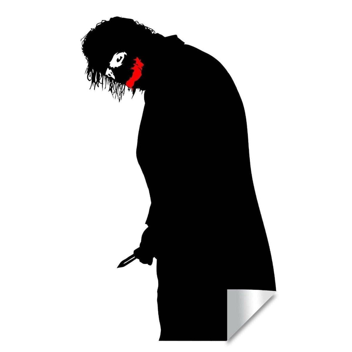Creepy clown vinyl decal featuring a menacing smile and shadowy figure, perfect for wall decoration.