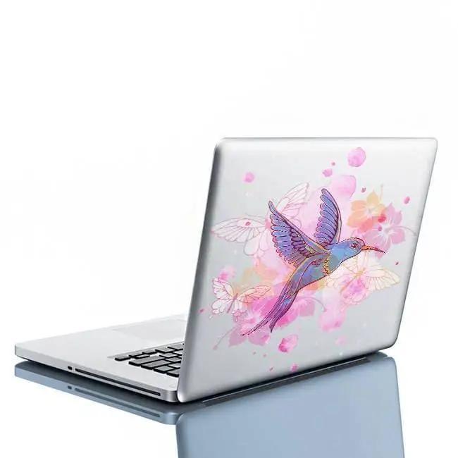 Colorful hummingbird vinyl sticker on a laptop, adding charm and beauty to home decor.