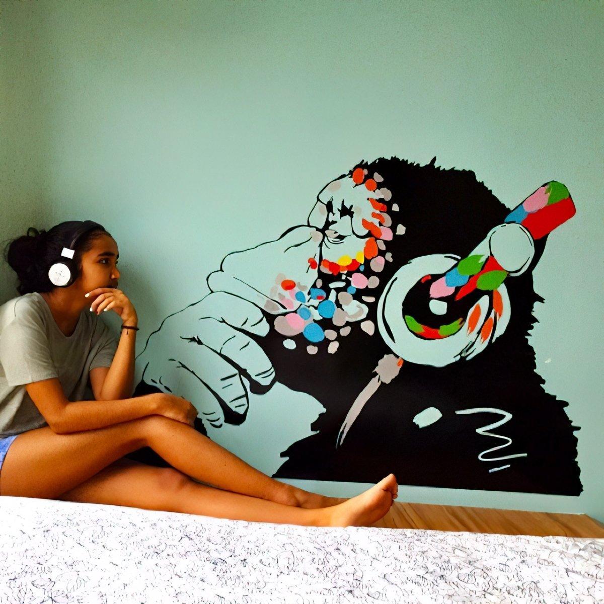 Cool monkey wall decal with headphones, perfect for kids' room decoration and inspired by street art.