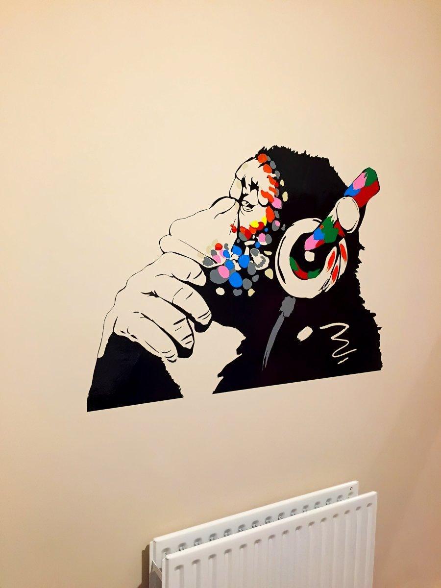 Thinking monkey wall decal with headphones, colorful design for kids room decoration.