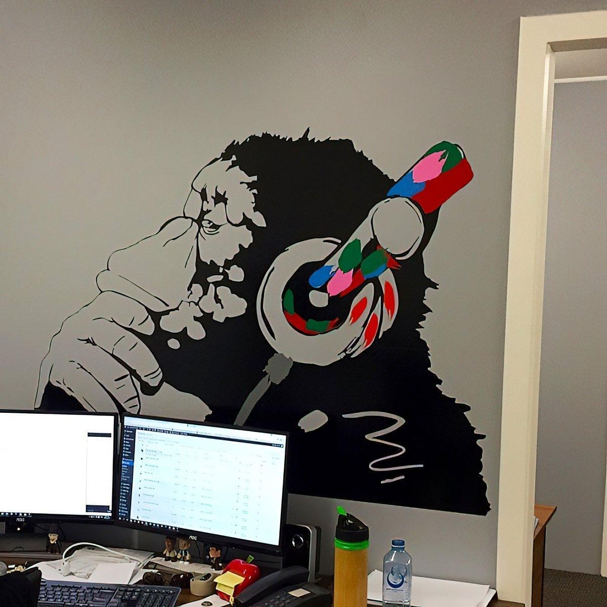 Cool monkey wall decal with headphones, perfect for kids' rooms or home decor inspired by street art.