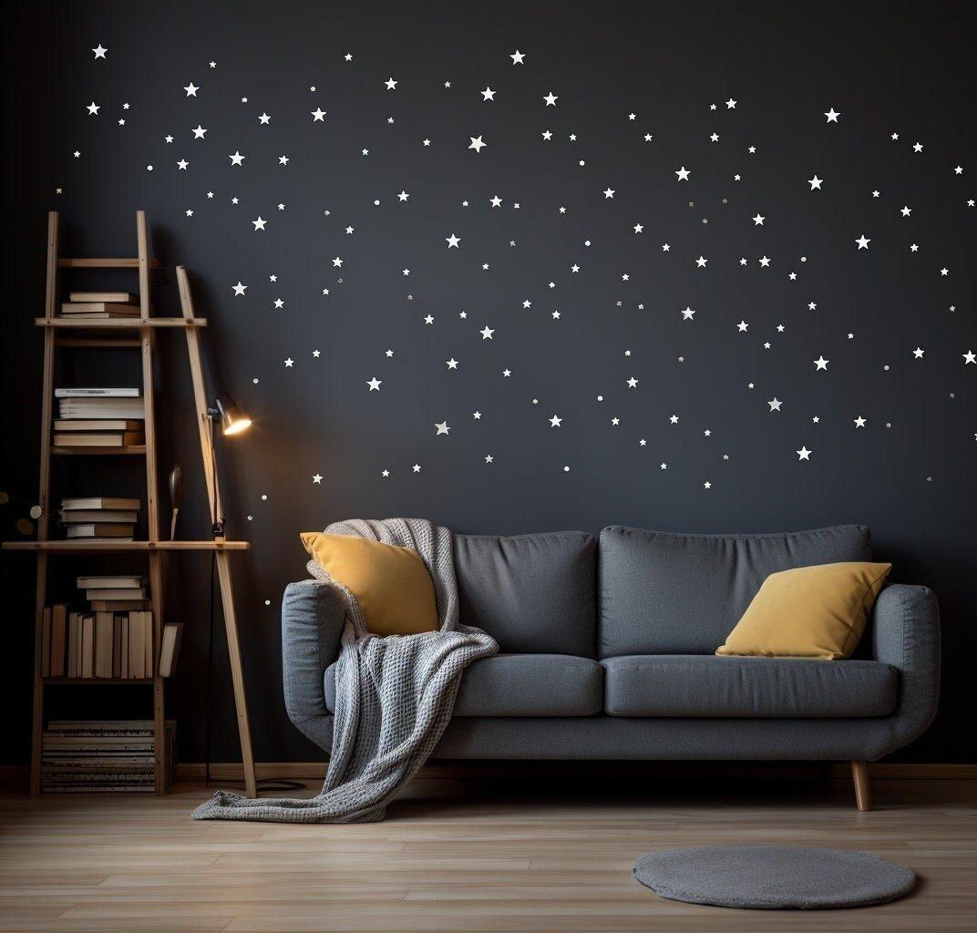 Room with grey sofa, yellow cushions, and star wall stickers creating a tranquil, cosmic atmosphere.