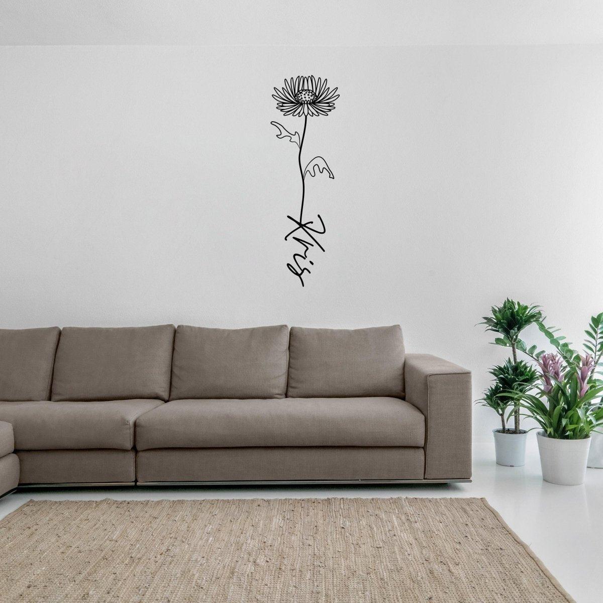 Personalized flower wall decal on a living room wall above a sofa, featuring a modern floral design.
