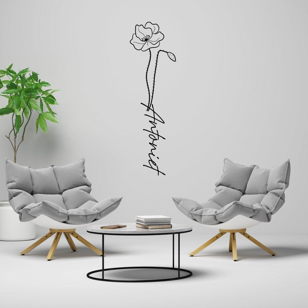 Personalized flower name decal in modern living room, showcasing a chic floral design and cozy seating.