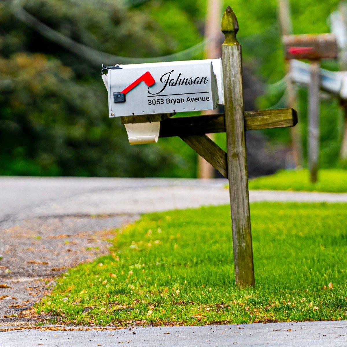 Personalized mailbox decal with cursive text and custom house number displayed on a residential mailbox.