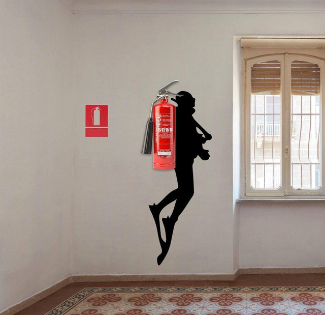 Scuba diver wall sticker decor with fire extinguisher, creating a unique underwater adventure theme in interior space.