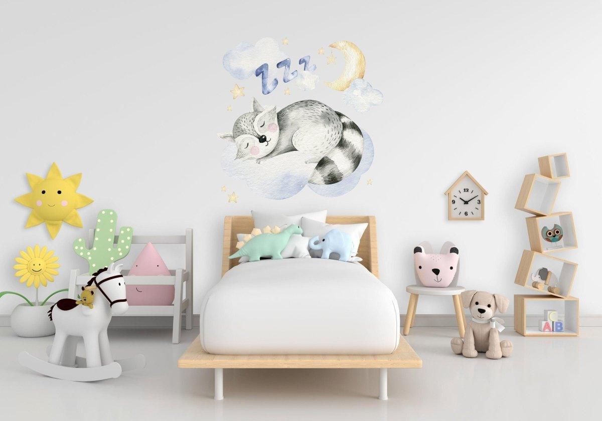 Dreamy creatures wall decal featuring a sleeping raccoon in a child's nursery with playful decor.