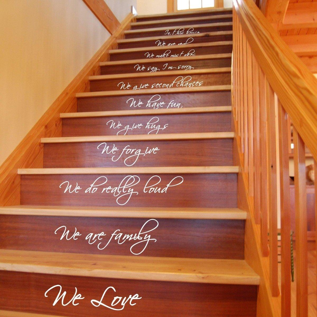 Stylish staircase with vinyl quote decals: 'In this house we have fun, hugs, forgiveness, and love' for home improvement.