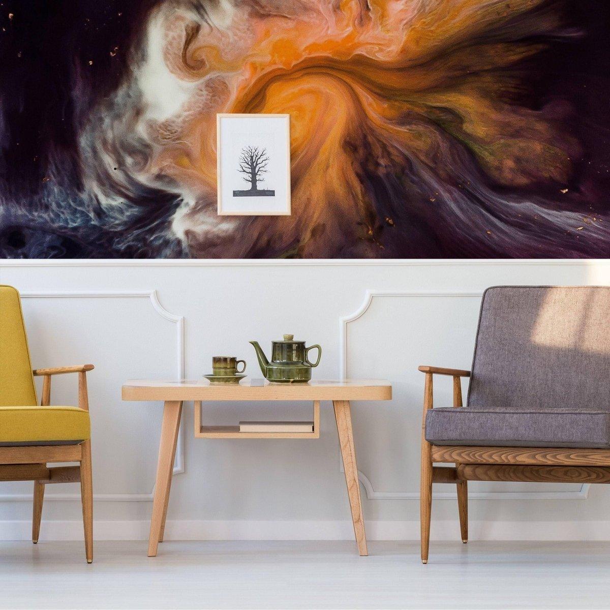 Stylish seating area with colorful wall art, modern table, and tea set, showcasing elegant interior decor.