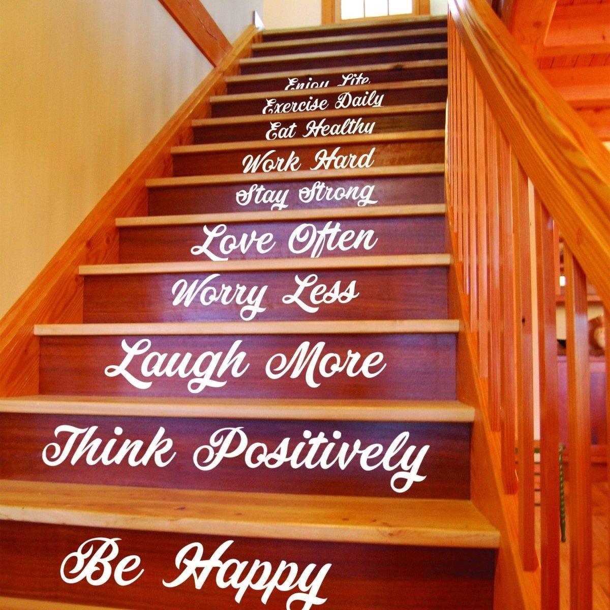 Vinyl staircase decals with inspiring quotes for home decor, showcasing phrases like 'Be Happy' and 'Think Positively'.