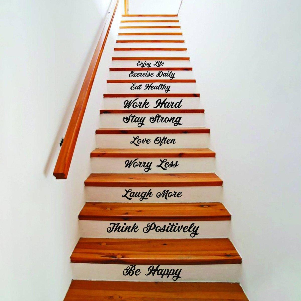 Vinyl staircase decals featuring inspirational quotes on wooden stairs for home decor.