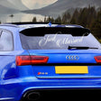 Just Married car sticker on a blue Audi RS6, perfect for wedding day decorations.