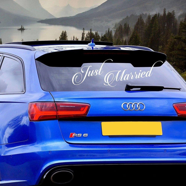 Just Married car sticker on a blue Audi RS6, perfect for wedding day decorations.