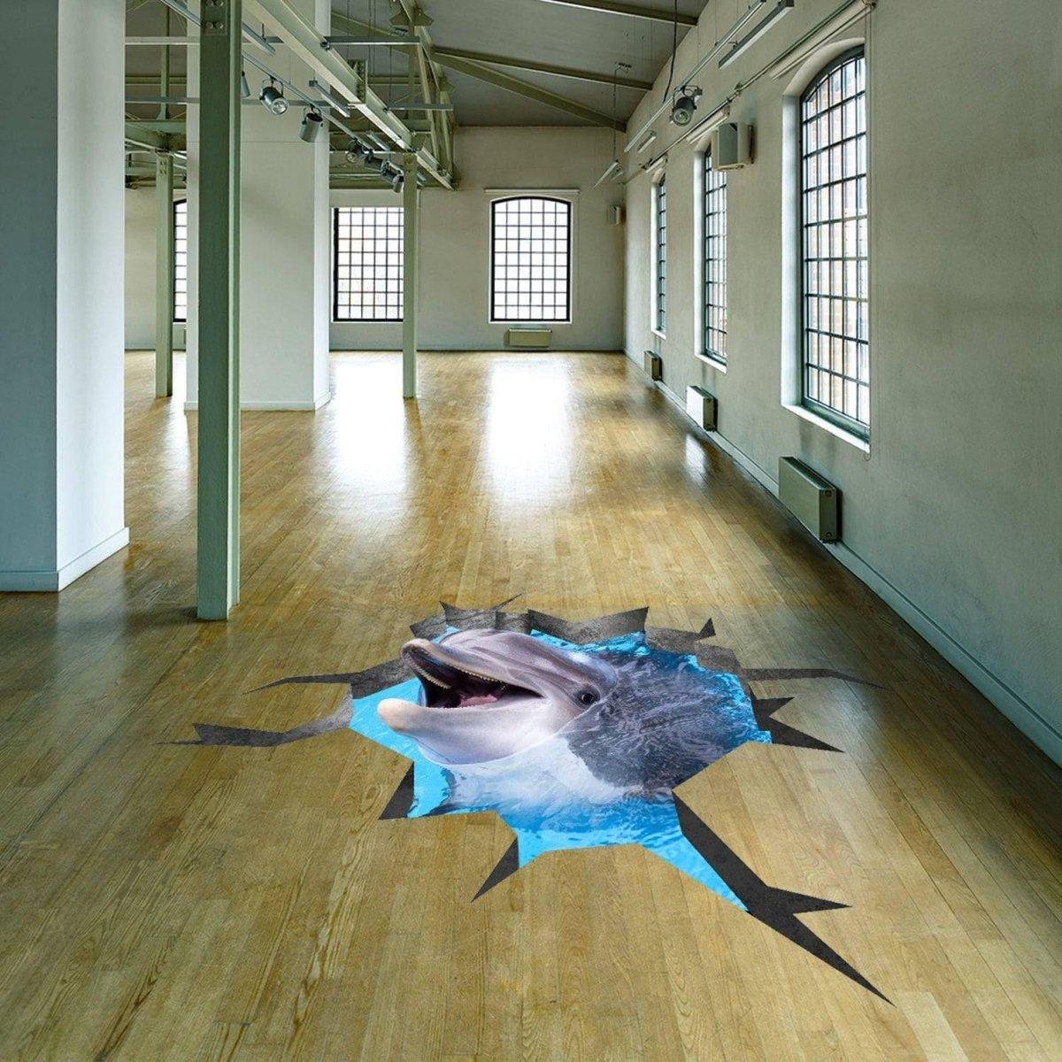 3D vinyl floor decal of a dolphin emerging from a cracked floor design in a spacious room.