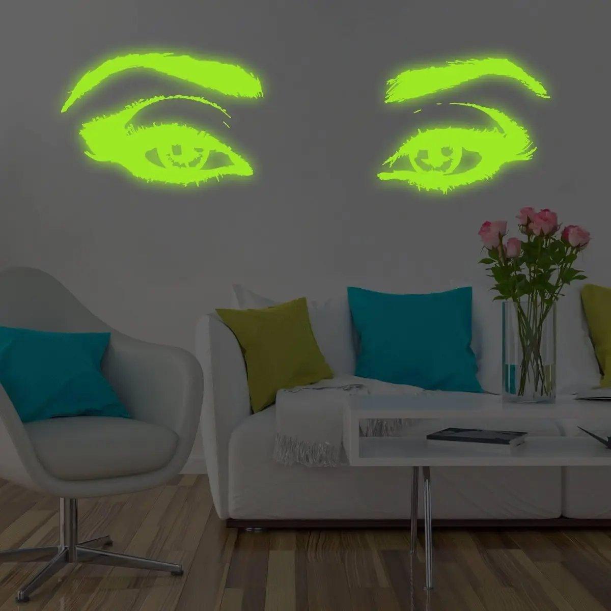 Glowing Eye Vinyl Wall Decal illuminating living room with vibrant colors and modern decor.