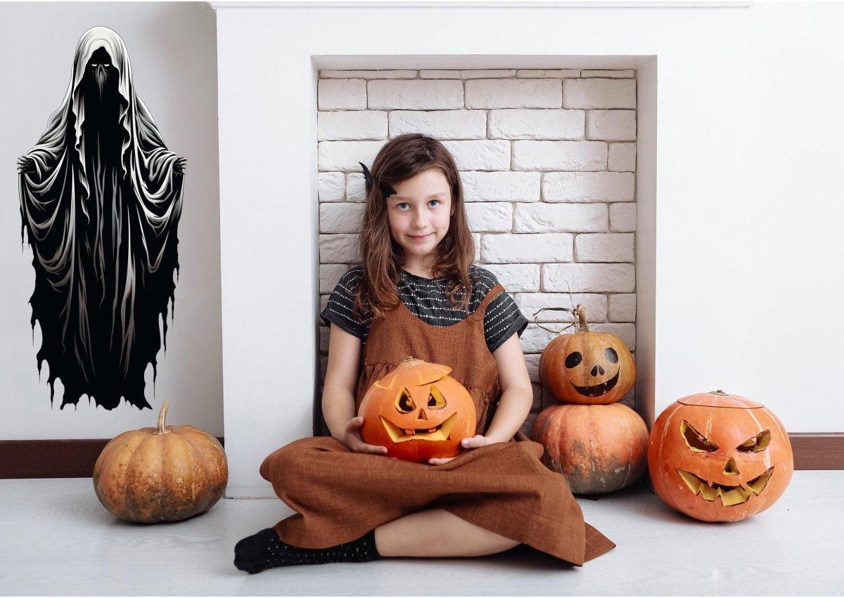 Girl holding a pumpkin in a cozy Halloween setup with spooky wall decal and carved pumpkins.