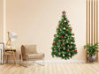 Festive pine wall decal of a Christmas tree with ornaments, adding holiday cheer to a modern living room.