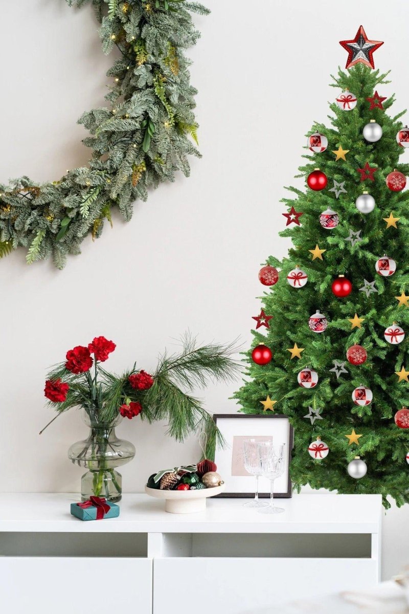 Festive pine wall decal styled with Christmas decorations, featuring red and gold ornaments and a cozy holiday atmosphere.