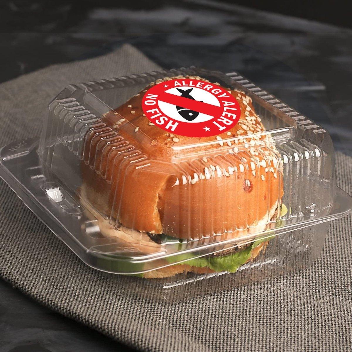 Allergy safety sticker on a sandwich container warning of no fish allergies for safe food handling.