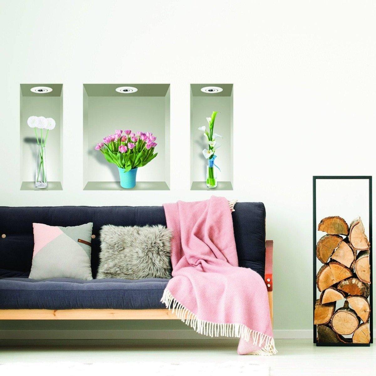 Vibrant 3D wall decals featuring flower vases above a cozy couch with a pink throw blanket.