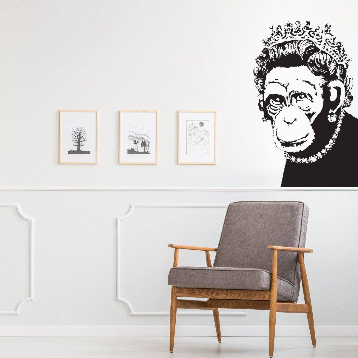 Queen Monkey vinyl wall art decal in stylish living room setting with chair and framed artwork.