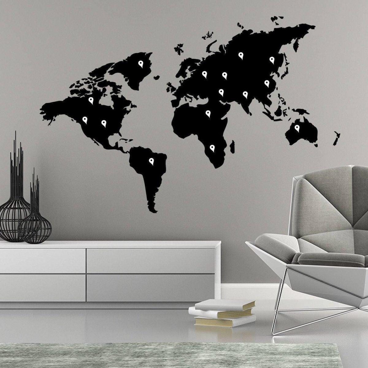 Stylish black world map vinyl sticker wall decal in modern living room design.
