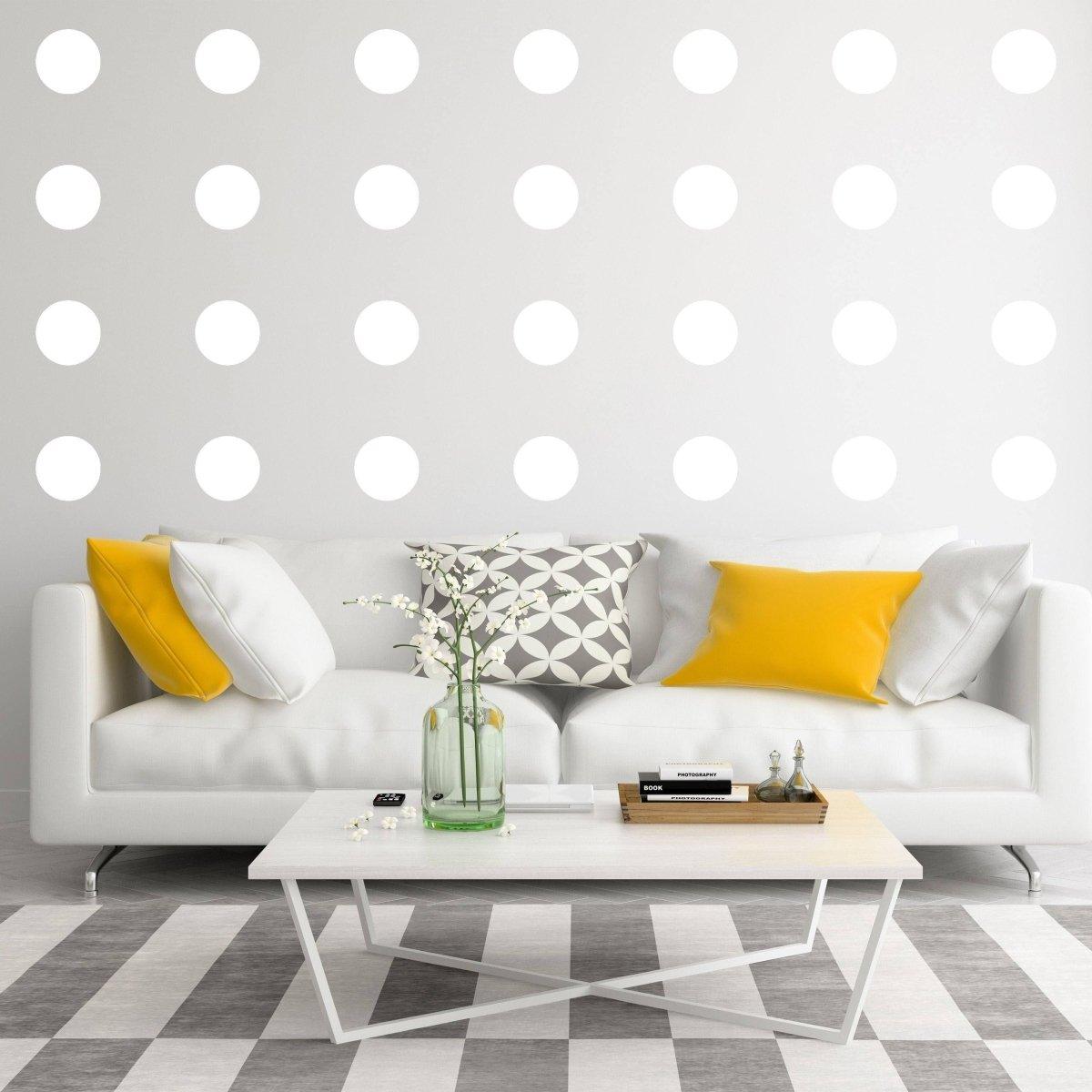 Modern living room with glow-in-the-dark wall dots and stylish yellow accents, perfect for space-themed decor.