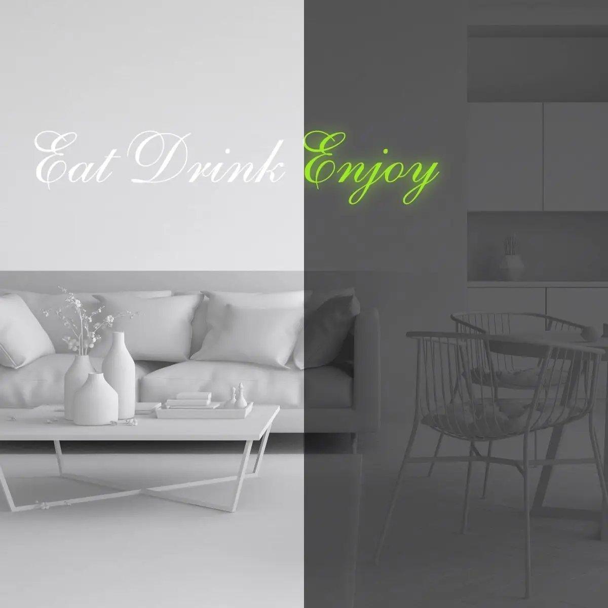 Glow in the dark 'Eat Drink Enjoy' vinyl decal on a stylish living room wall, illuminating the space.