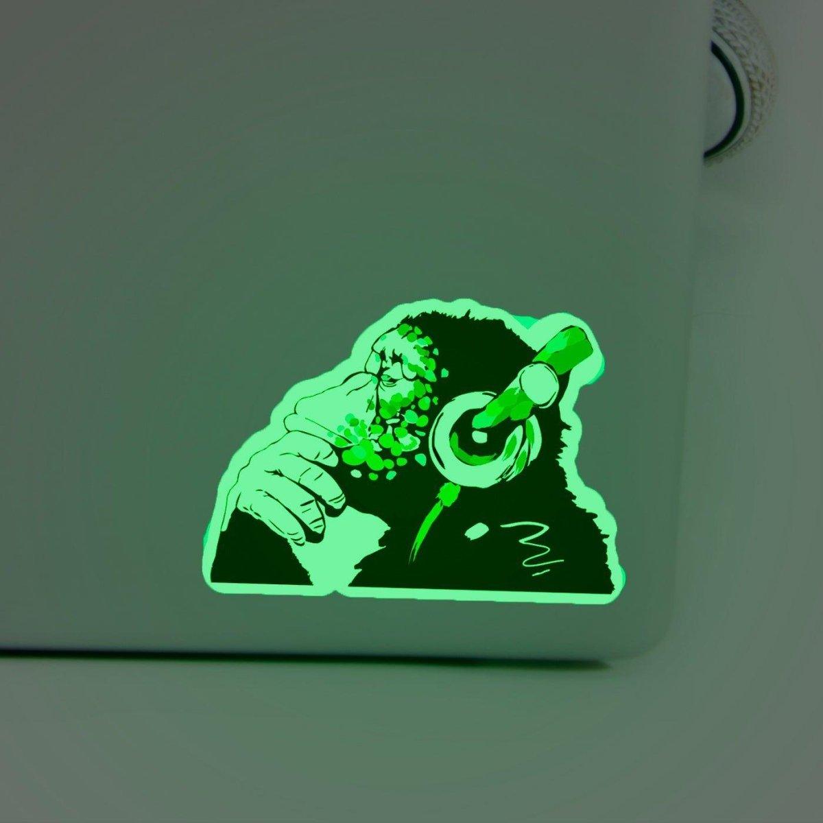 Glow in the dark monkey laptop decal featuring a monkey with headphones, perfect for adding fun to your tech.