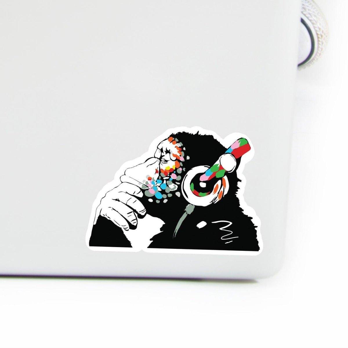Colorful monkey sticker with headphones on a laptop, adding a fun and funky vibe to your tech.