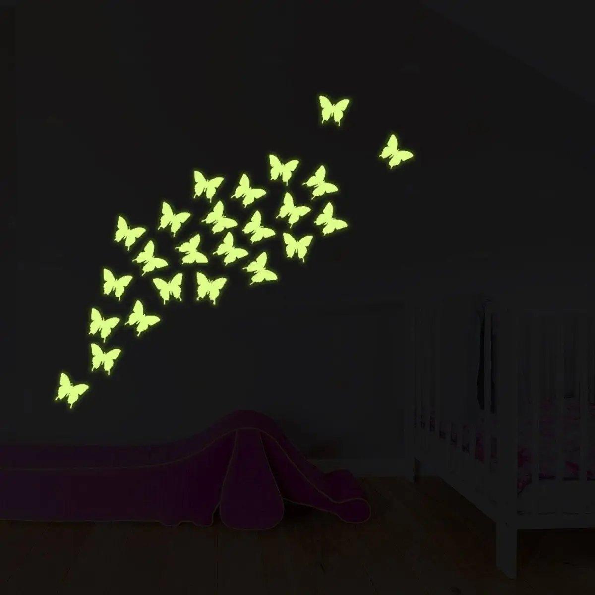 Glowing night butterflies wall decal illuminating a child's room, creating a whimsical and enchanting atmosphere.