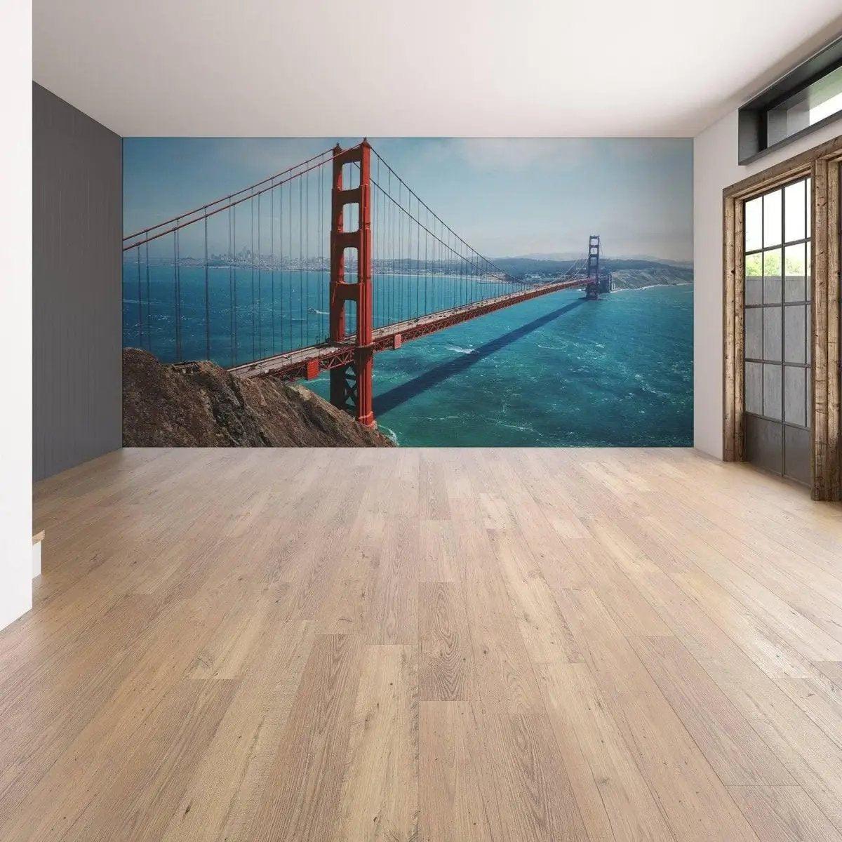 Golden Gate Bridge vinyl wall decal in a modern room, showcasing San Francisco skyline and blue ocean.