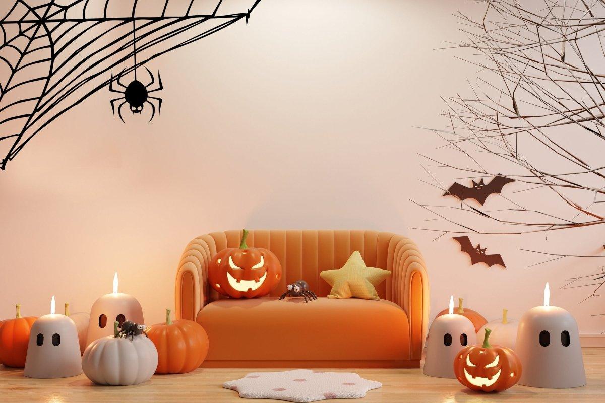 Spooky Halloween decor featuring spider web wall decals, pumpkins, and ghost candles in a cozy living room setting.