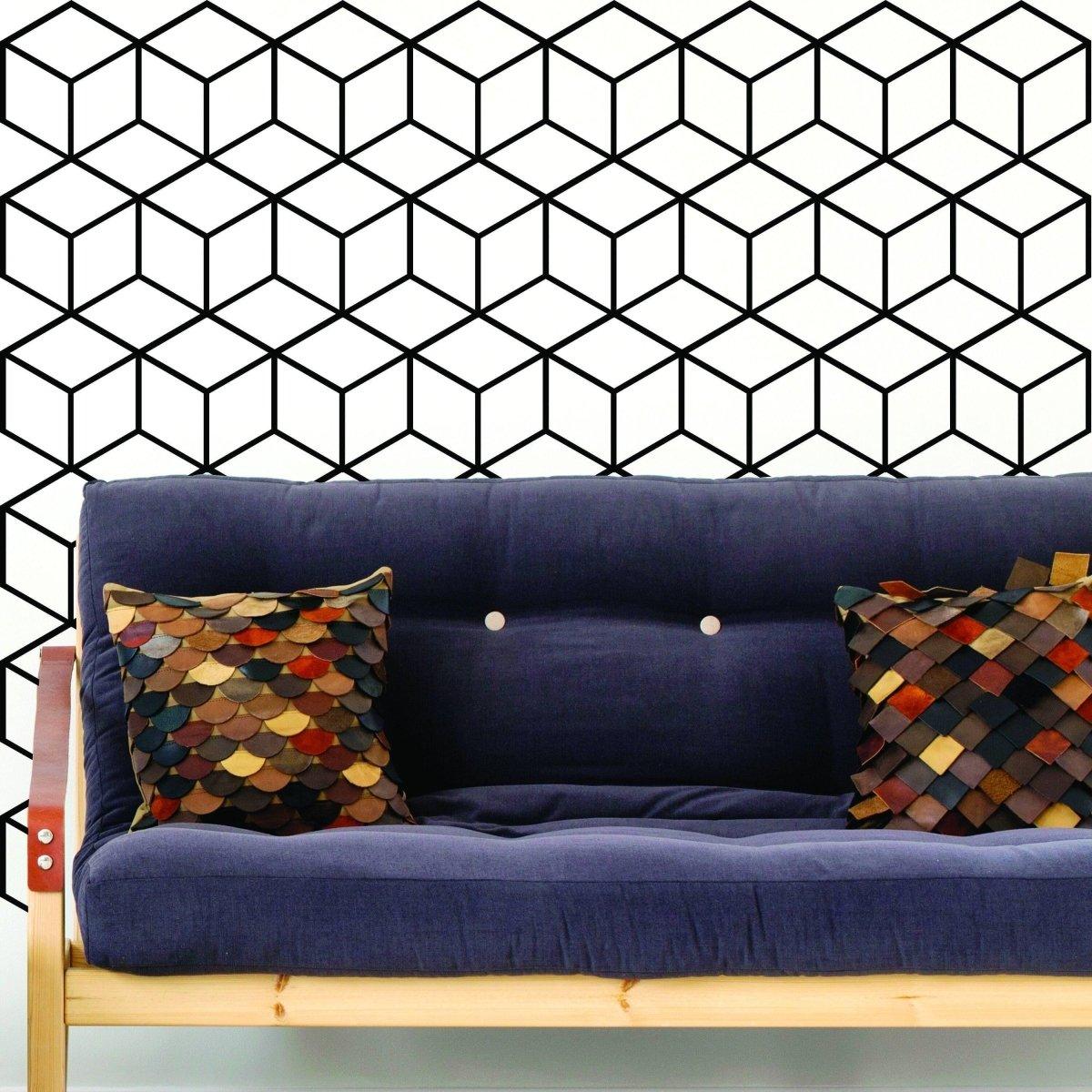 Hexagonal honeycomb wall decal in modern living room with blue sofa and colorful pillows.