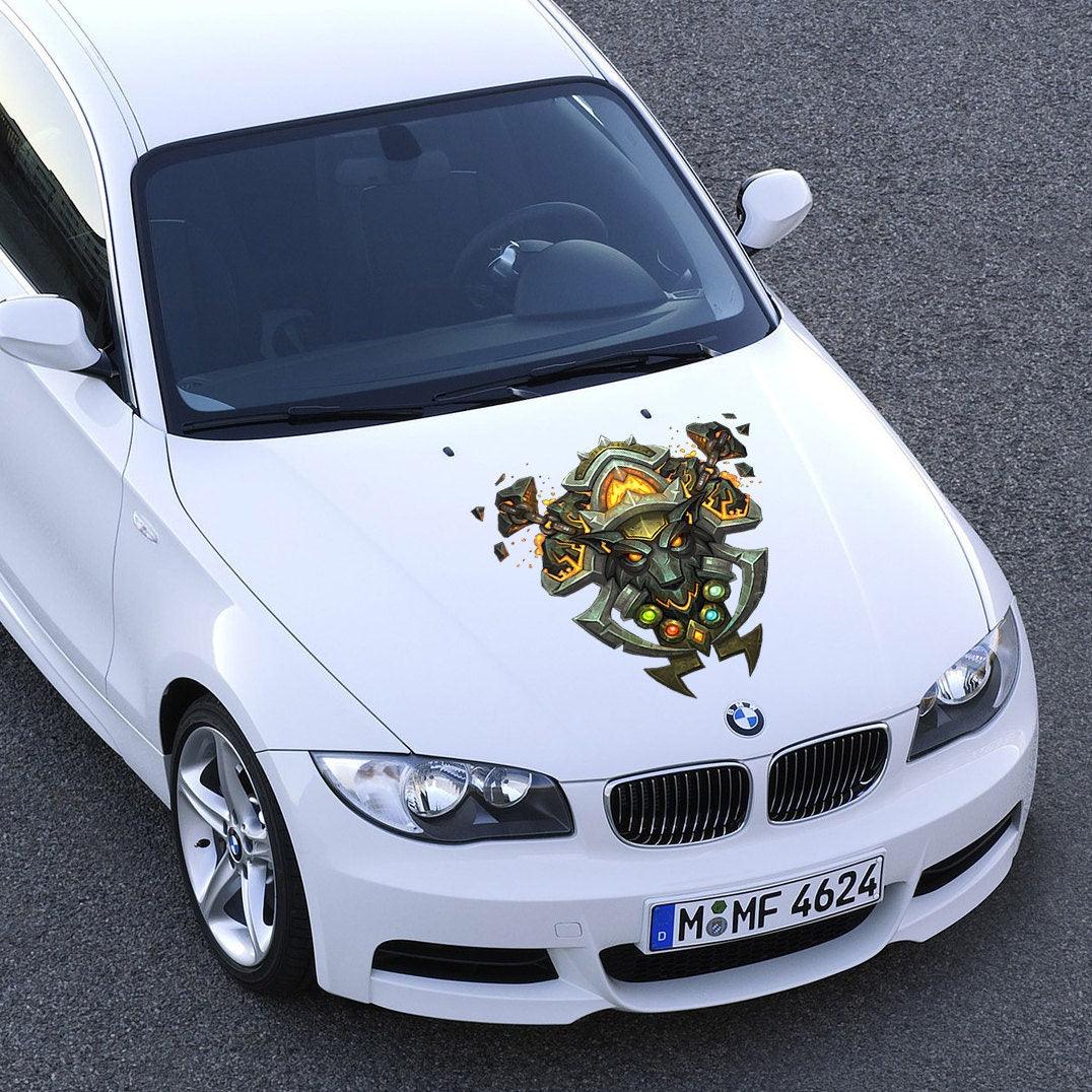 Custom vinyl sticker on a white car hood featuring unique art design for personalization and style.