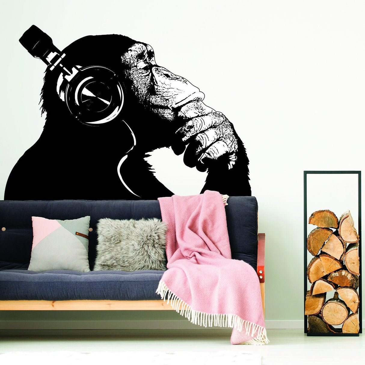 Banksy-inspired wall decal of a thinking monkey wearing headphones, perfect for home decor.