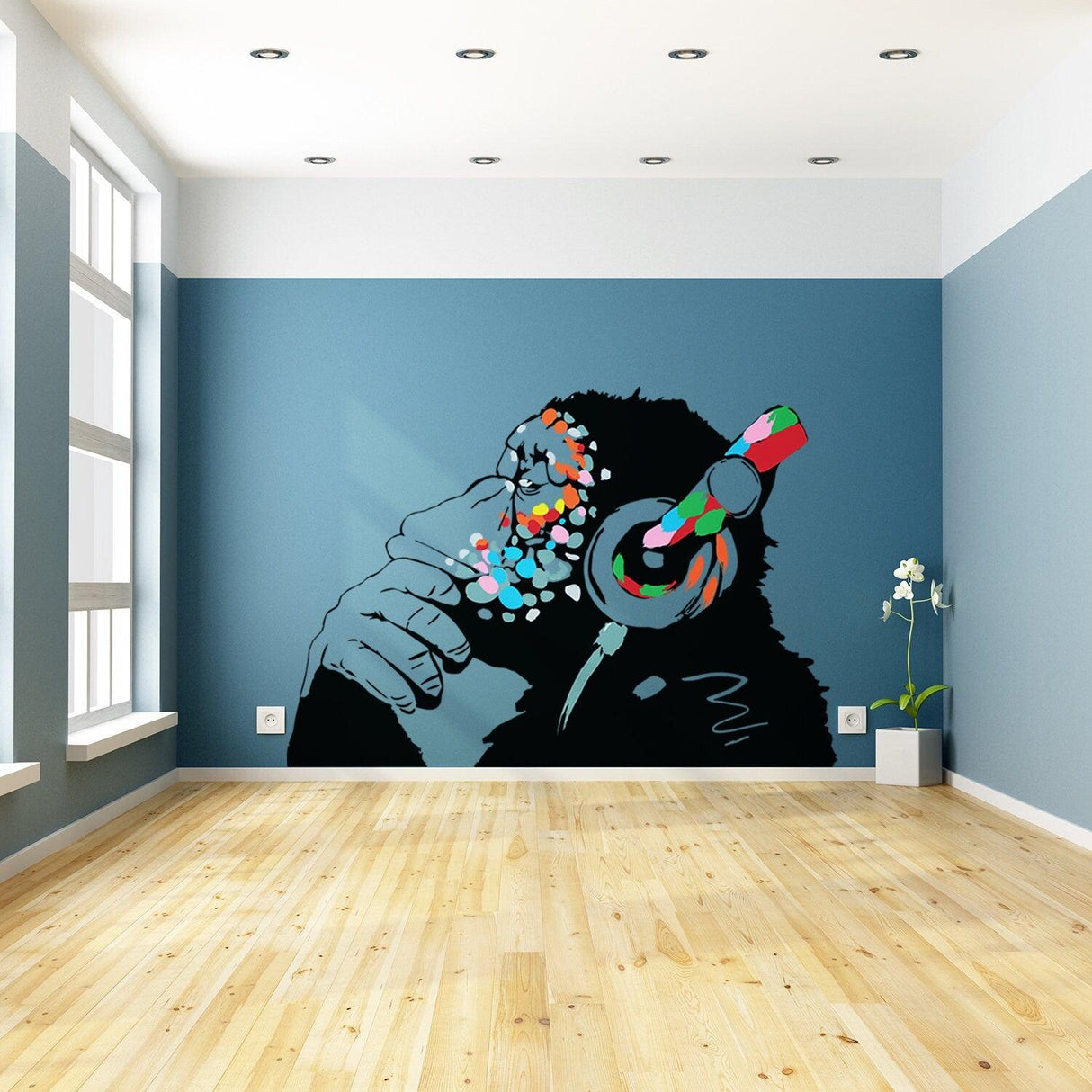 Banksy Thinking Monkey Sticker featuring a colorful monkey with headphones on a blue wall, enhancing urban decor.