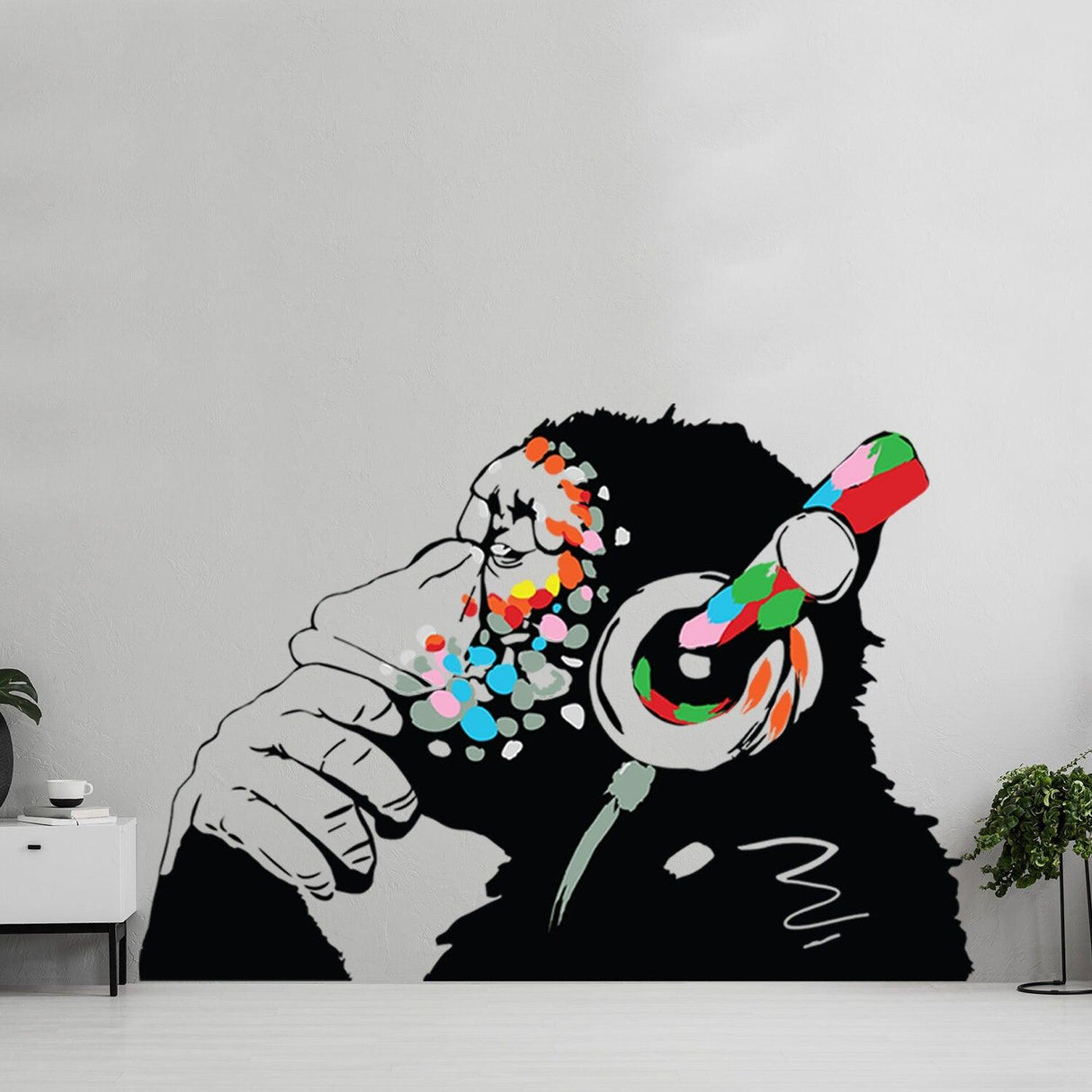 Banksy Thinking Monkey sticker in vibrant colors, featuring a monkey with headphones, perfect for urban wall decor.