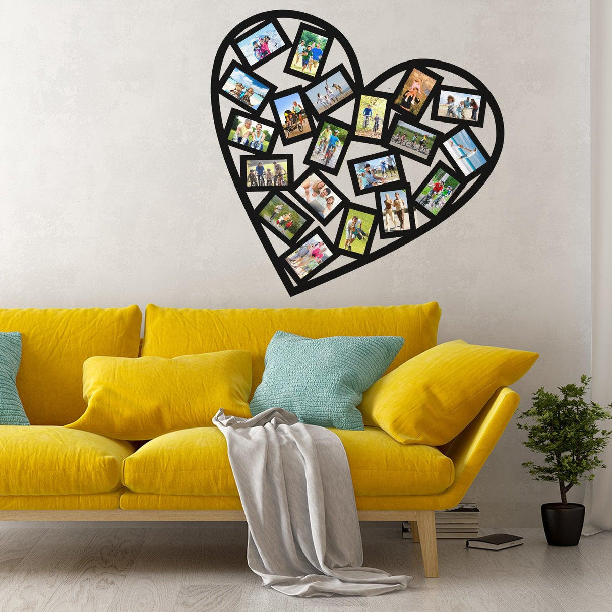 Heart-shaped picture frame wall sticker displaying memories above a cozy yellow sofa.
