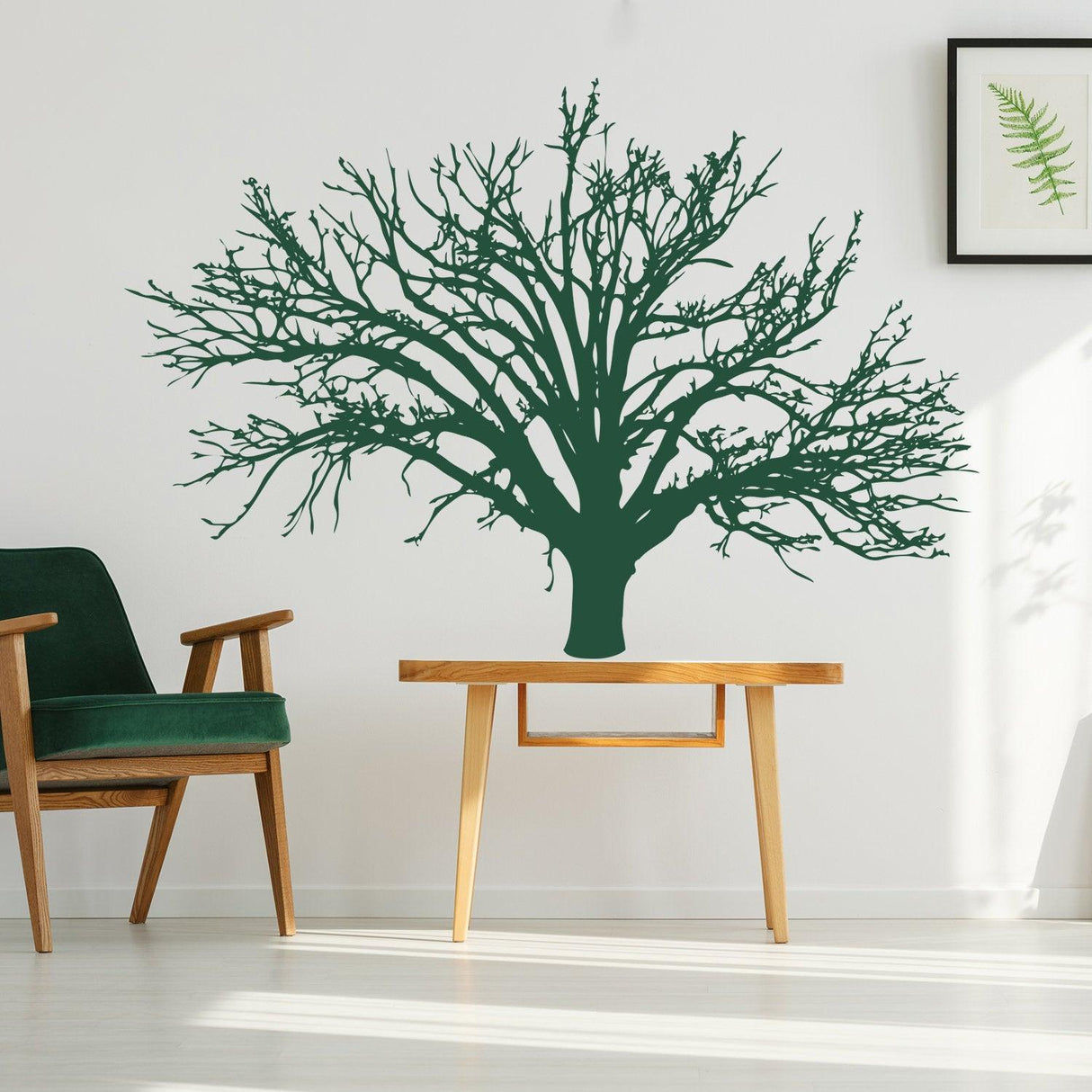 Green tree wall decal design, perfect for nursery or living room decor, showcasing intricate branches on a white wall.