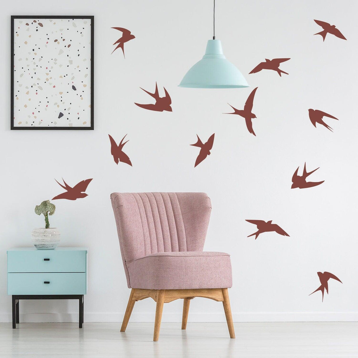 12x flock of birds wall stickers in a stylish living room with pink chair and blue accent table