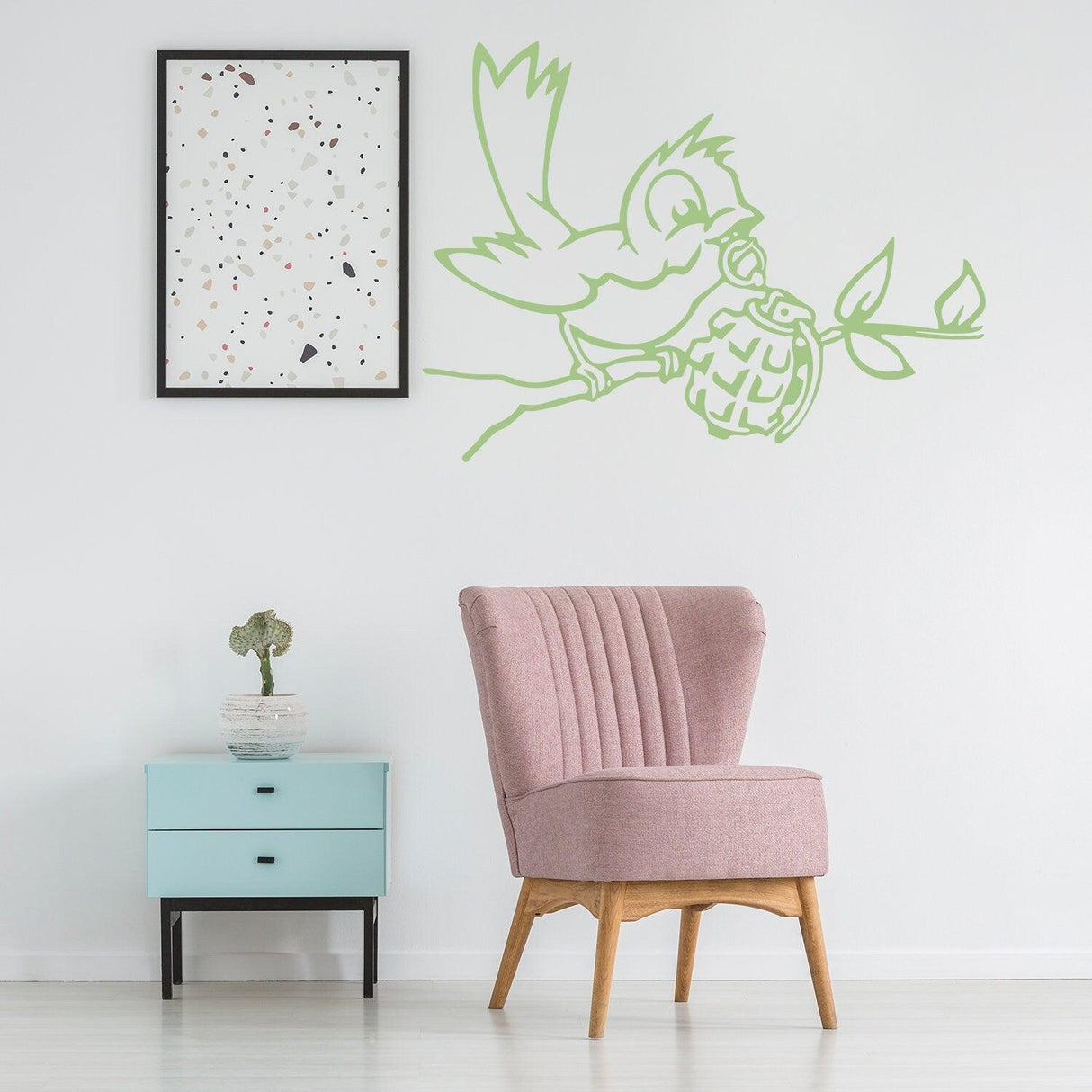Banksy Bird With Grenade wall sticker in a modern room, showcasing urban street art decor on a white wall.