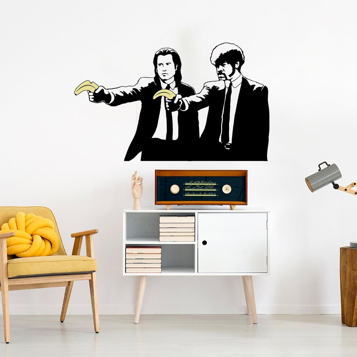 Banksy Pulp Fiction sticker wall art featuring two characters holding bananas in a stylish living room.